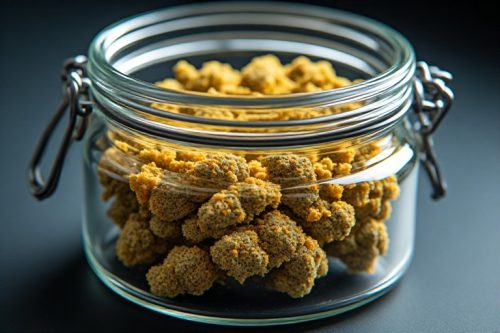 Airtight glass jar with humidity pack storing a golden hash brick, following how to store hash Canada best practices.