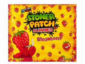 Stoner Patch Dummies Strawberry cannabis-infused gummies in colourful blue and yellow packaging. The package contains 500mg THC total and features distinctive strawberry-themed Stoner Patch Dummies branding.