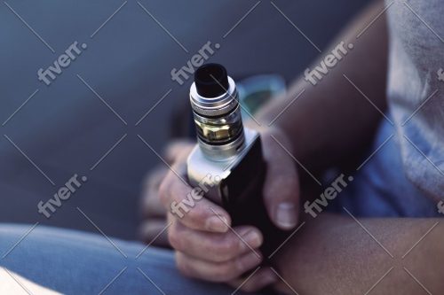 Beginner learning how to use a THC vape pen in Canada with EndoKana cartridge and 510-thread battery.